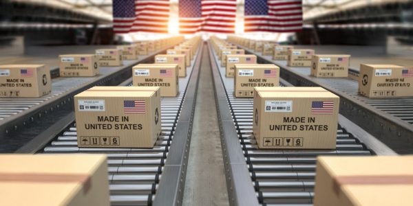 Made in USA United States. Cardboard boxes with text made in USA and american flag on the roller conveyor. Made in USA United States. Cardboard boxes with text made in USA and american flag on the roller conveyor. 3d illustration